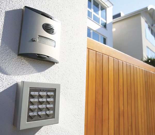Residential access control system with intercom and keypad installed at a modern home entrance